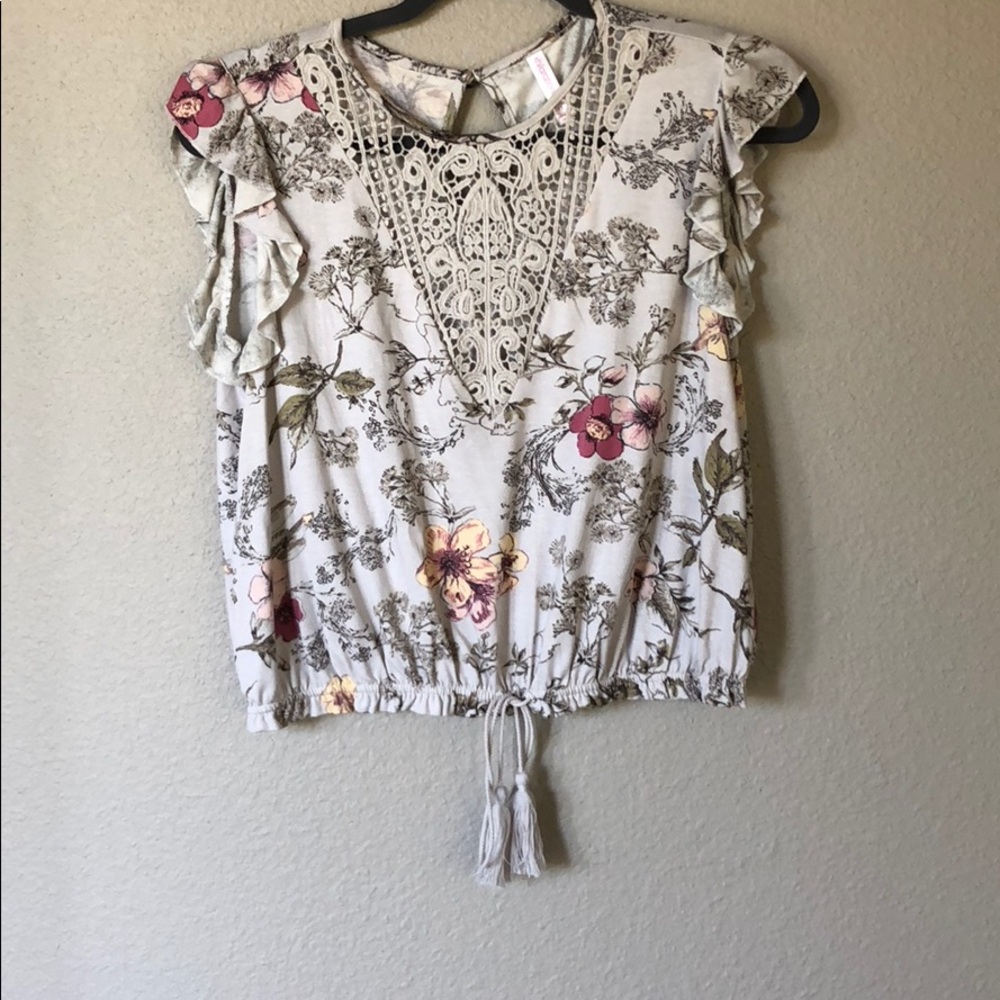 Floral top with lace detail and tassel bottom